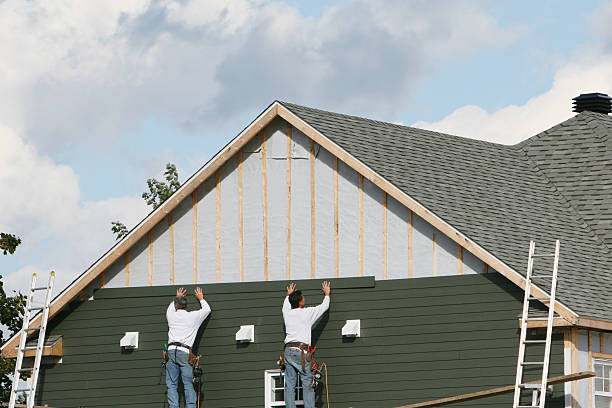 Professional Siding technician working in Lansing, OH